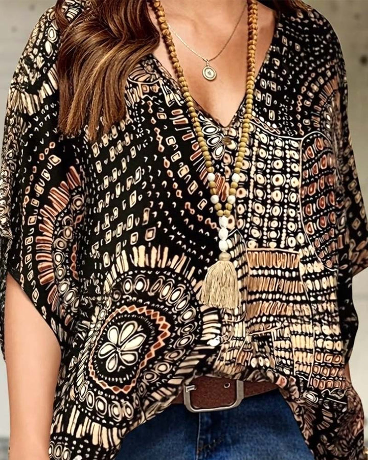 Blouse à col V imprimée à manches chauve-souris