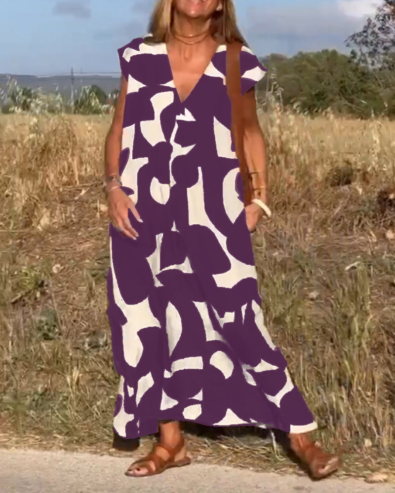Robe mi-longue à motifs et col V plongeant