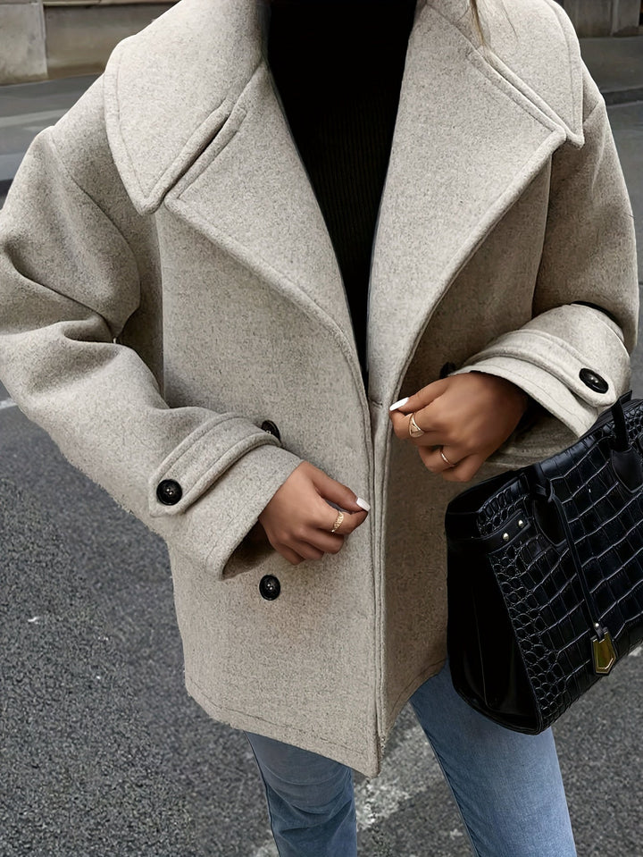 Veste élégante à double boutonnage et détails boutons