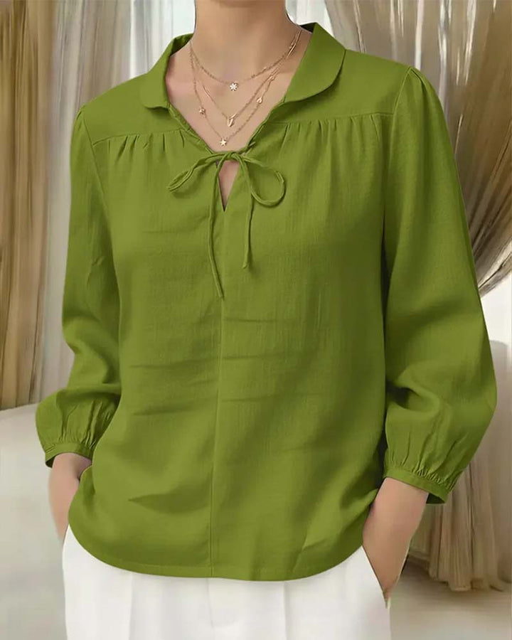 Blouse unie avec col Peter Pan et nœud
