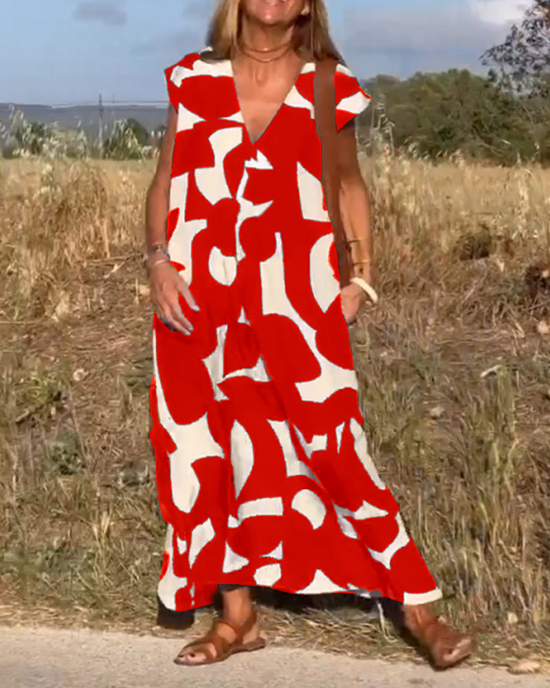 Robe mi-longue à motifs et col V plongeant