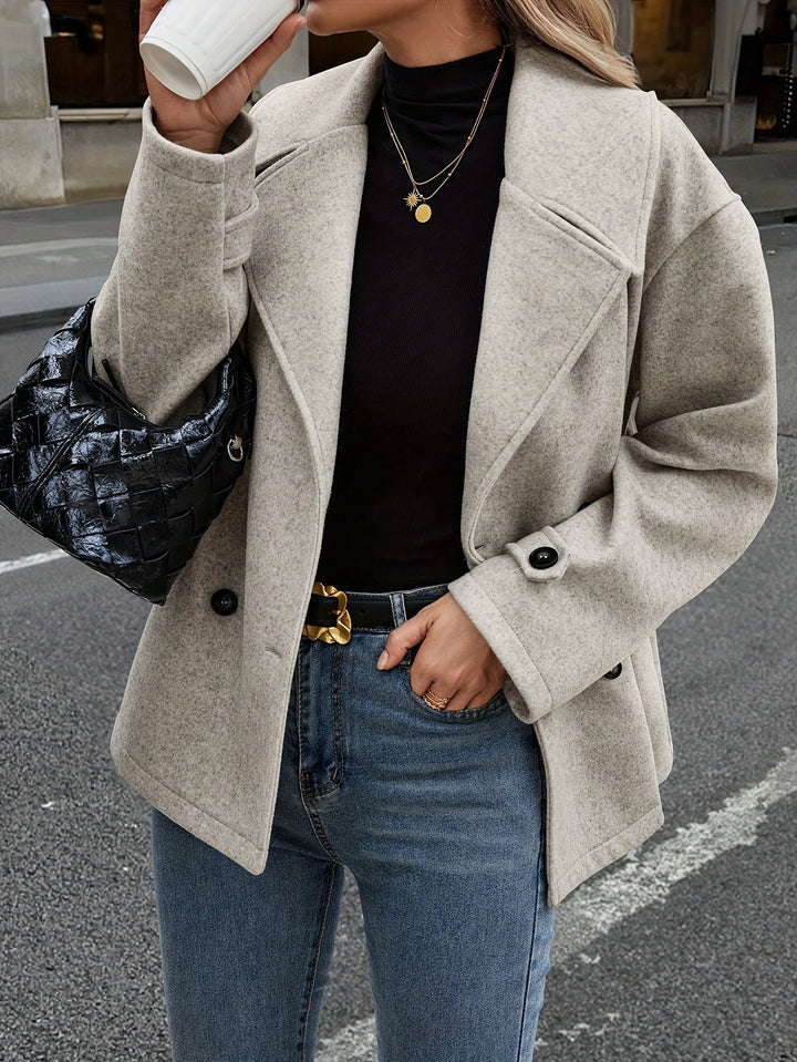Veste élégante à double boutonnage et détails boutons