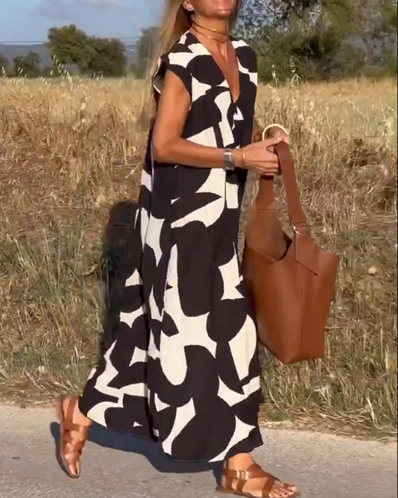 Robe mi-longue à motifs et col V plongeant