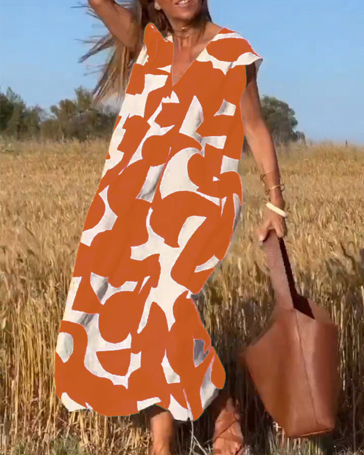 Robe mi-longue à motifs et col V plongeant