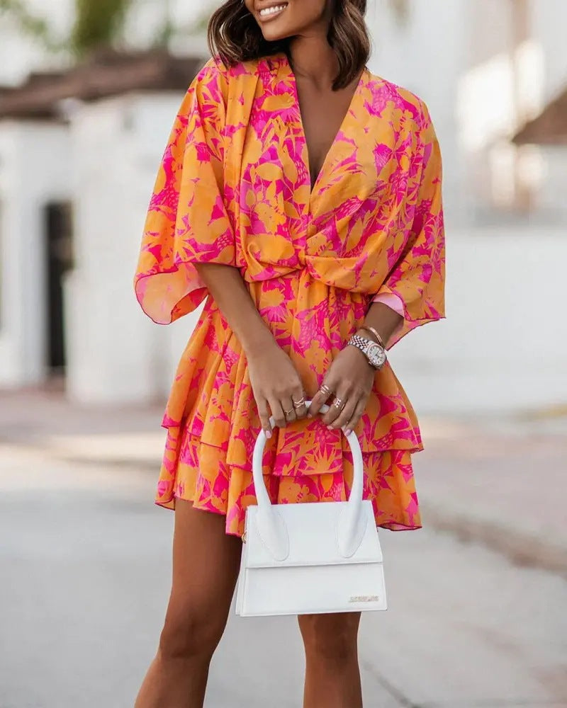 Robe fluide à manches chauve-souris avec un élégant col en V