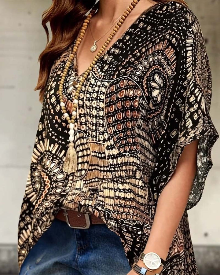 Blouse à col V imprimée à manches chauve-souris