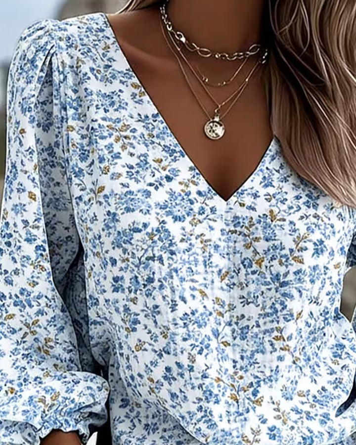 Blouse à manches bouffantes florale à col en V