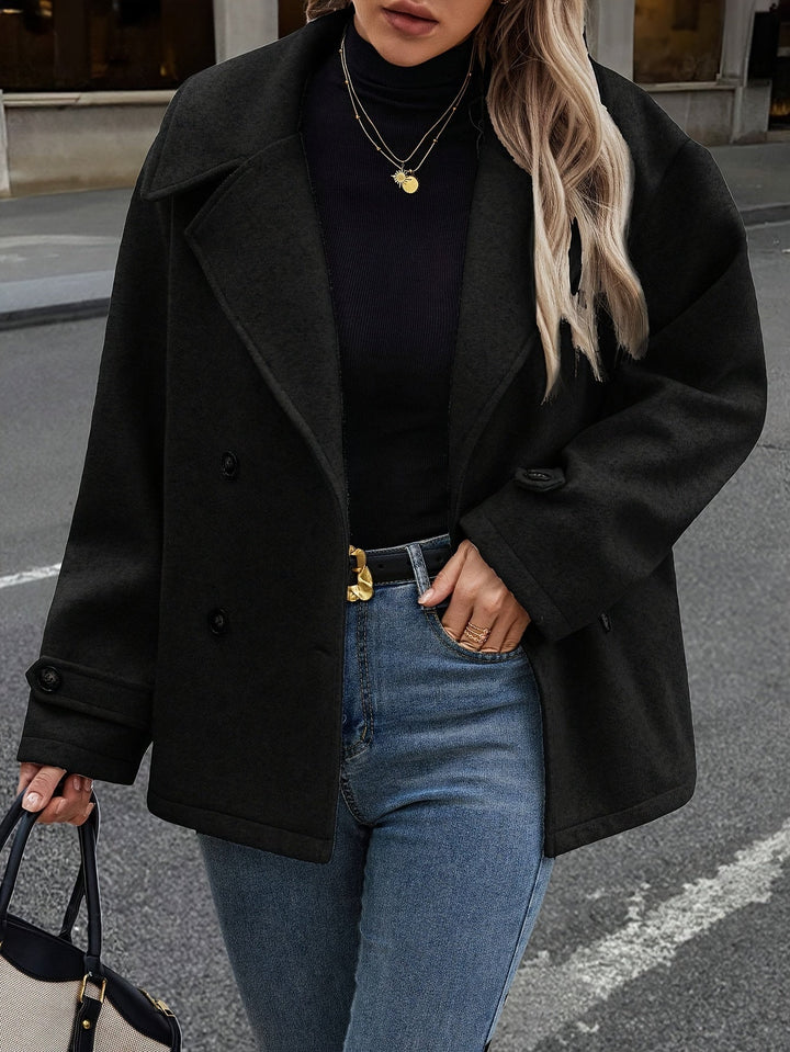 Veste élégante à double boutonnage et détails boutons